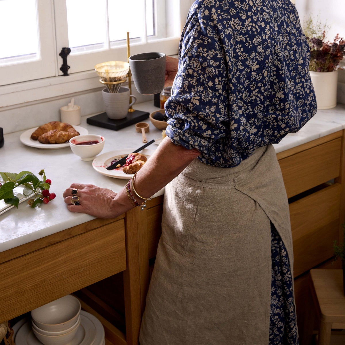 Natural linen and leather apron handcrafted for hosting cooking or serving guests