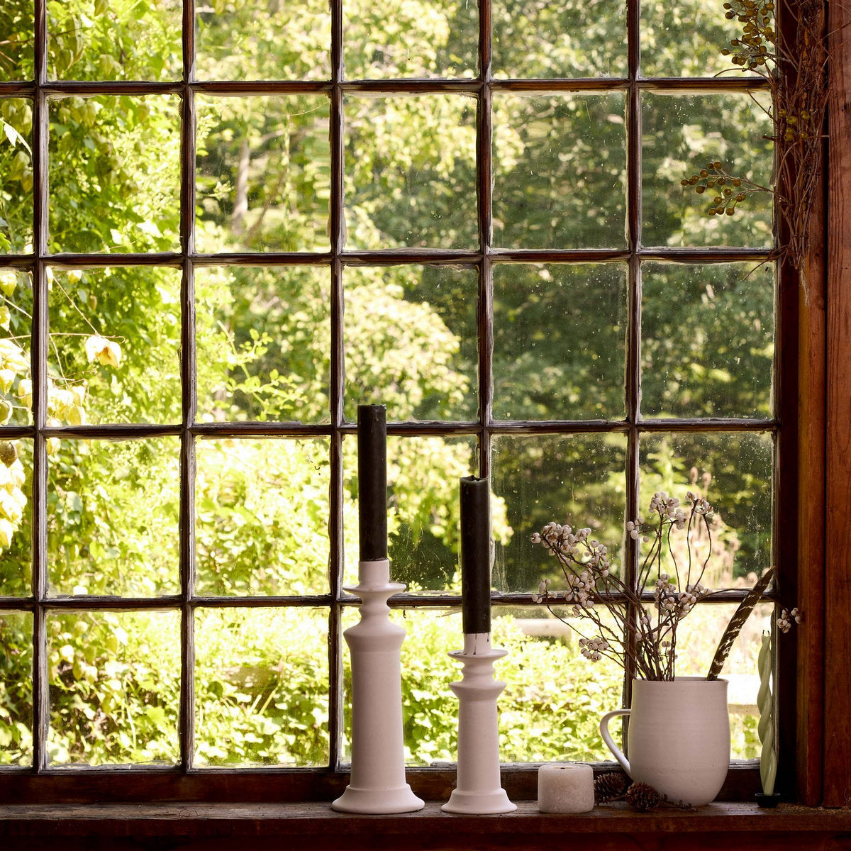 Versatile white ceramic pitcher for drinks, fresh juice, or floral display