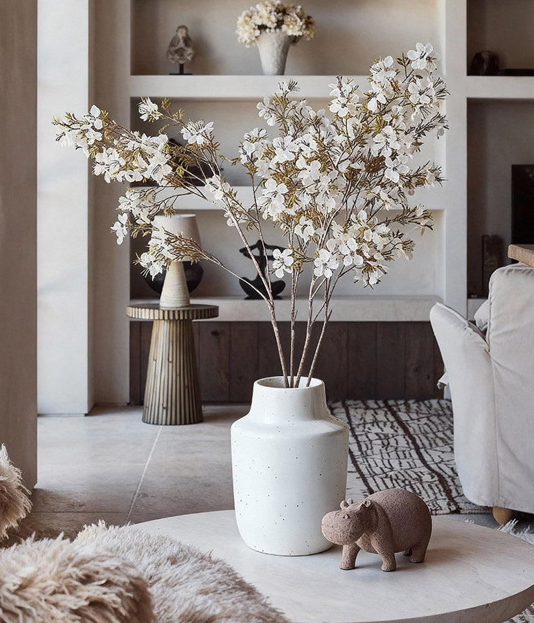 Faux cherry blossom branches with lifelike fabric petals for year round styling