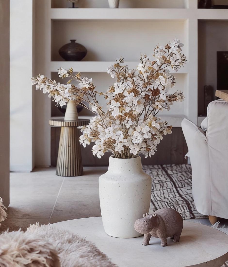 Faux cherry blossom branches with lifelike fabric petals for year round styling