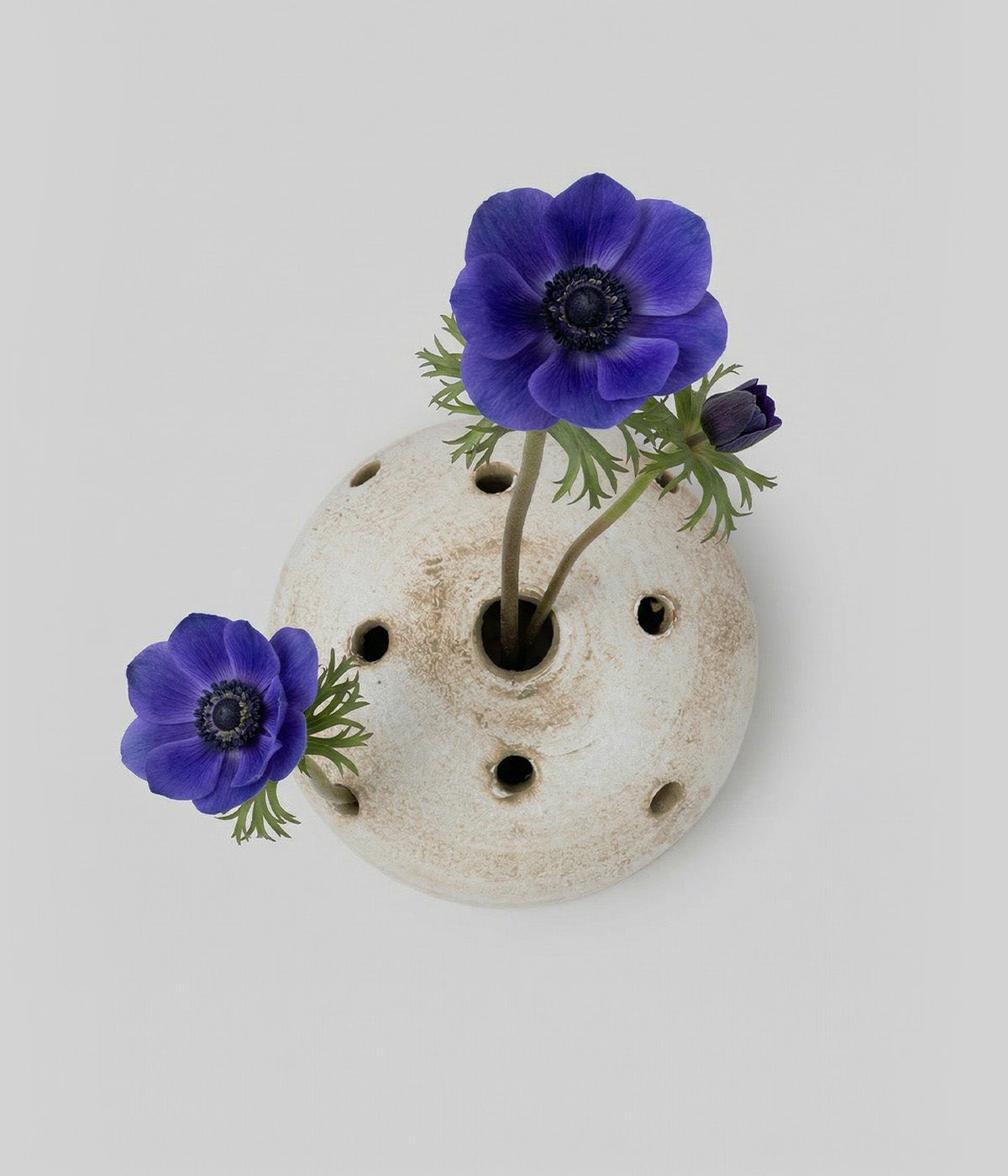 Ceramic flower frog stem holder in white finish for floral arranging