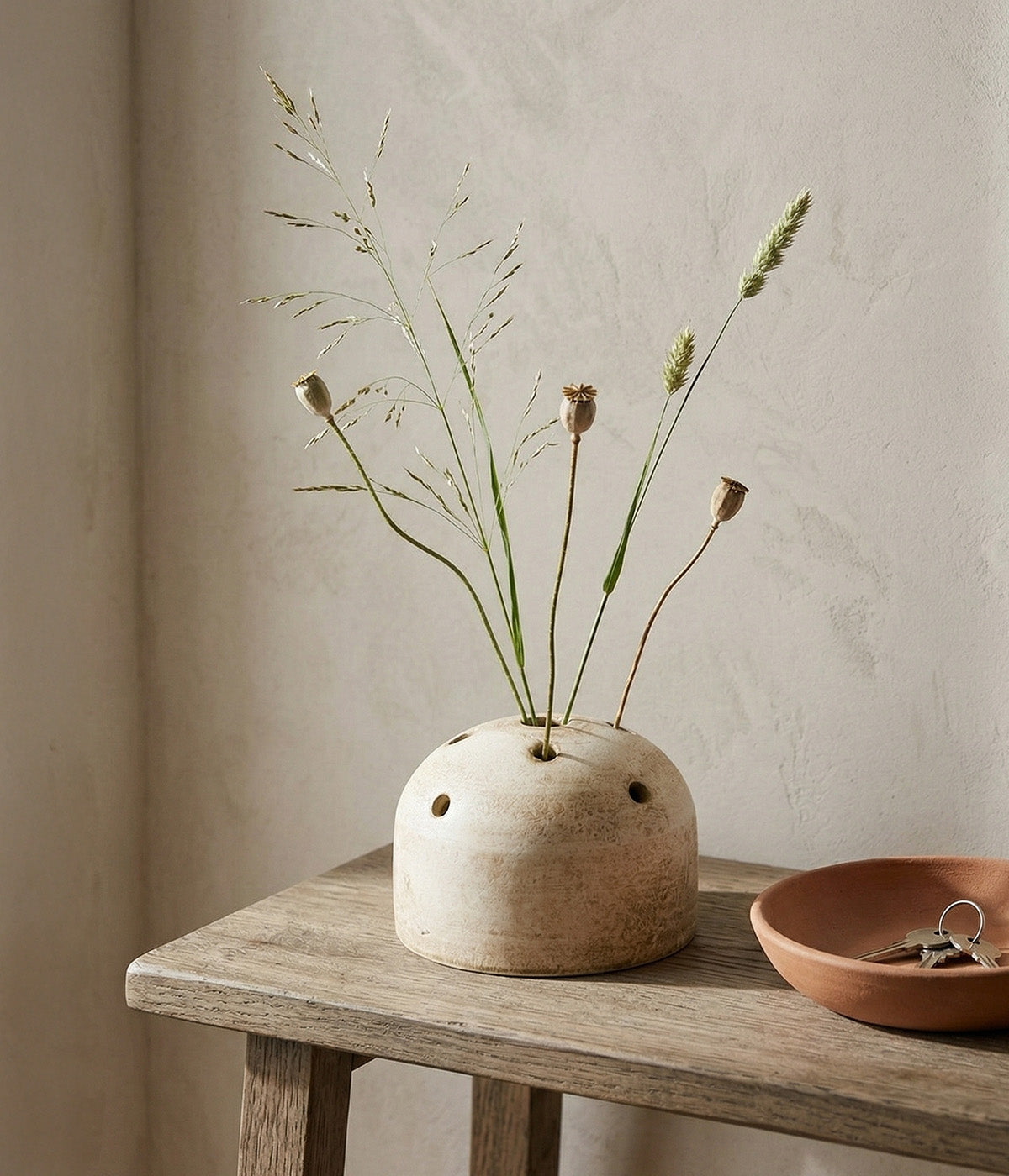 White ceramic frog vase with perforated stem holes