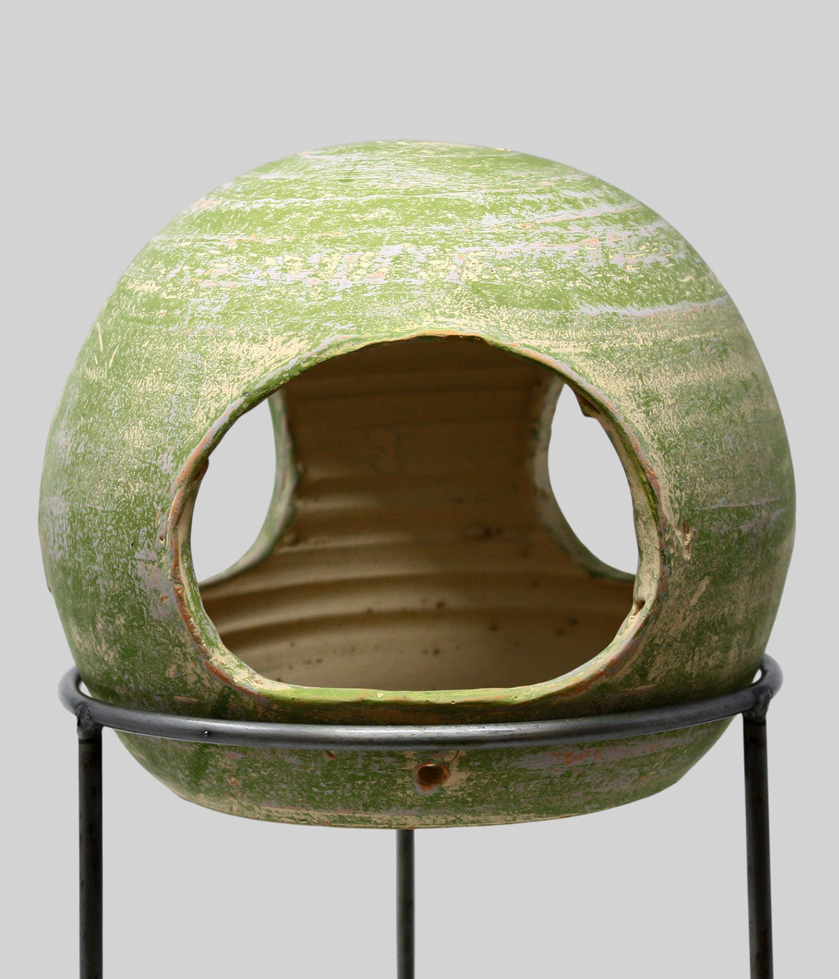 Close-up of the Garden Sage terracotta bird feeder showing the broad feed opening on a metal stand