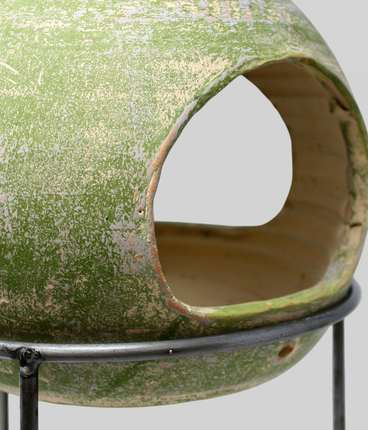 Close-up of the Garden Sage terracotta bird feeder showing the side openings