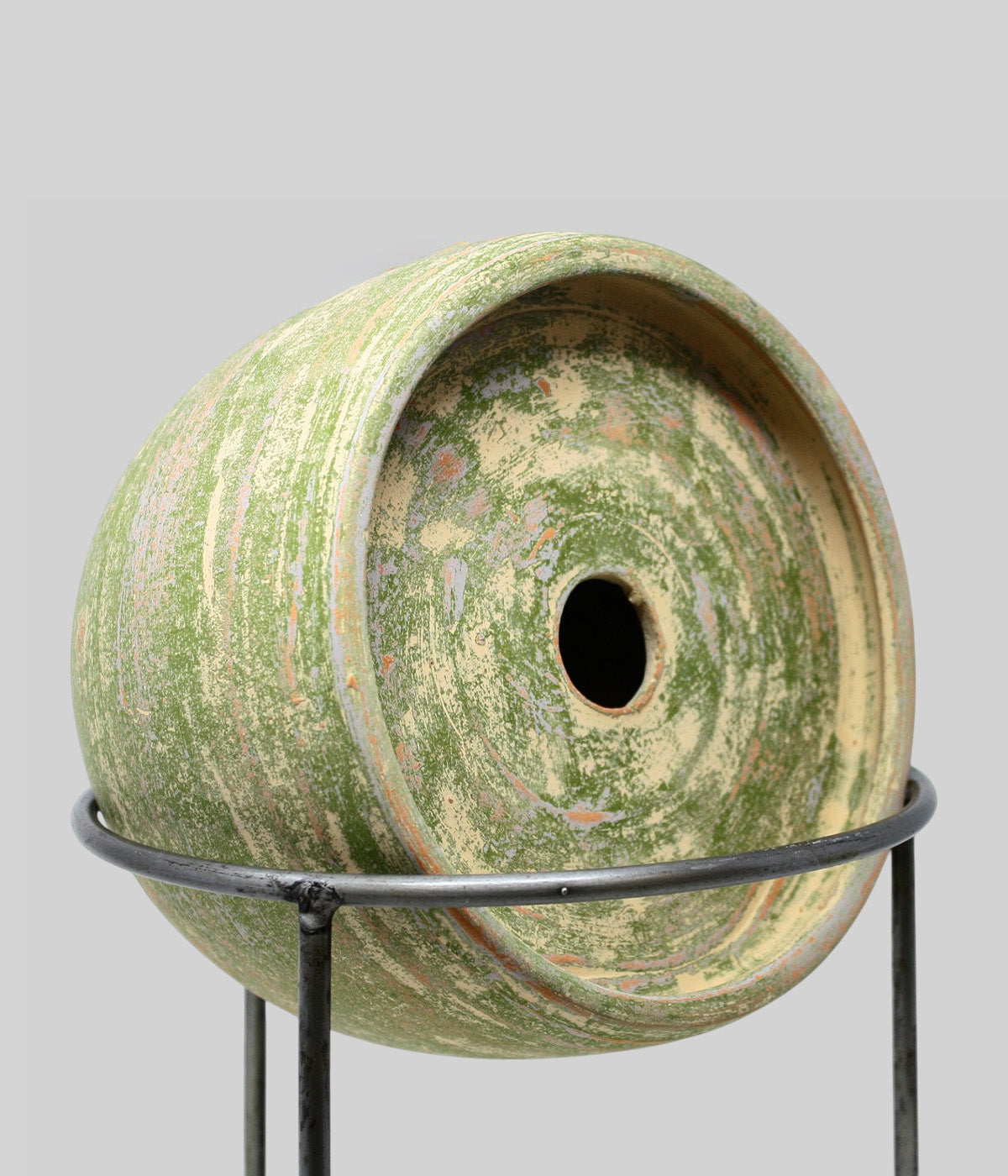 Bloomist x NYBG Garden Sage terracotta birdhouse on a wrought iron stand, showing its recessed front and centered round entry opening