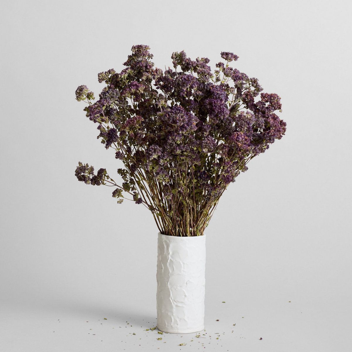 Stucco vase with sculptural hand-applied peaks and ridges