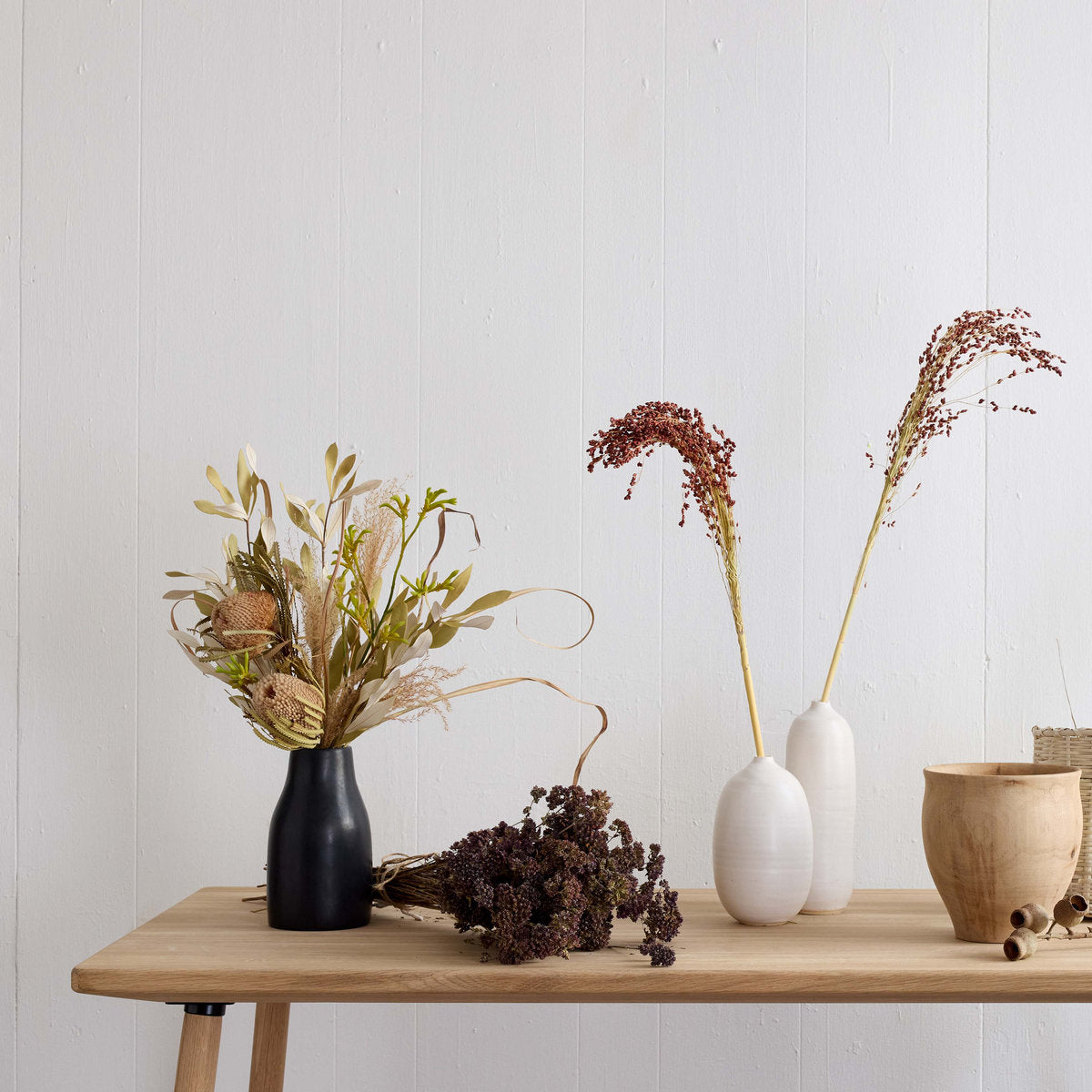White ceramic vase with tall bottle shape and matte finish