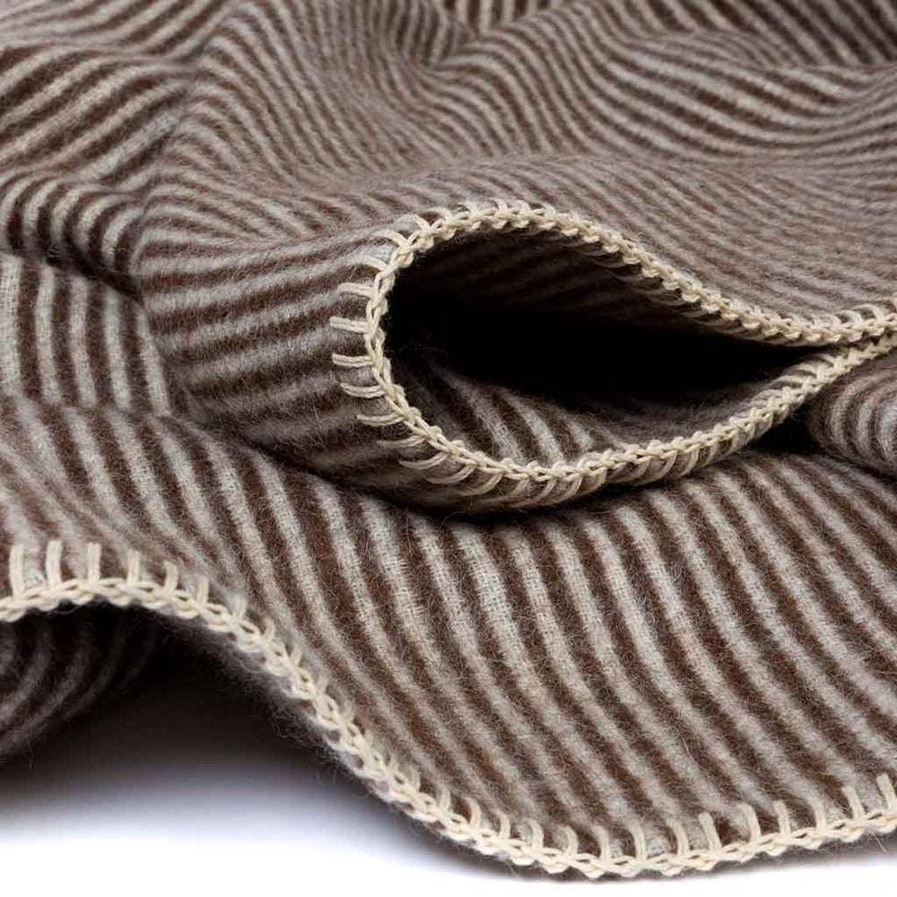 Cortez throw ivory face showing fine vertical coffee micro stripes