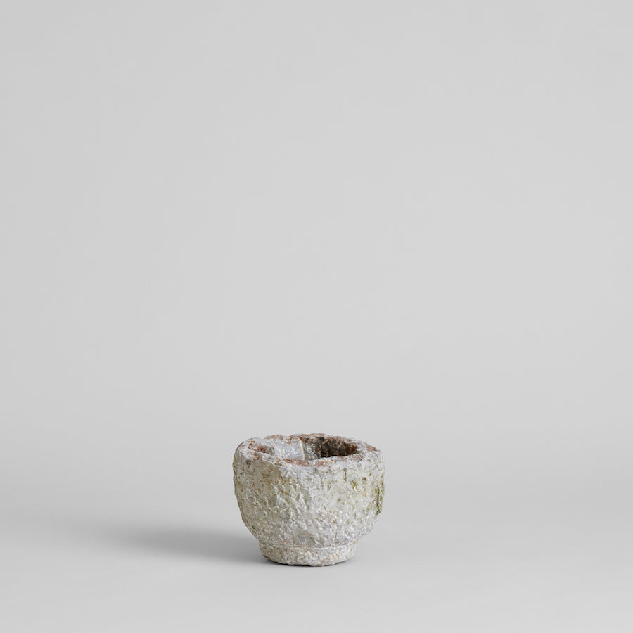 Carved stone bowl with natural aged patina and hand-carved details