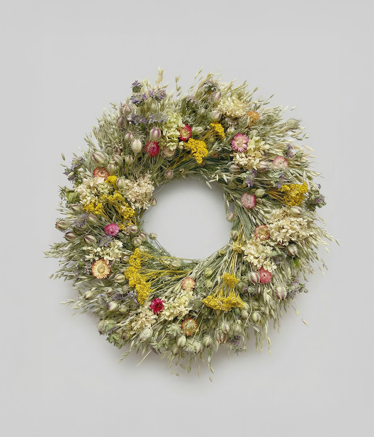 Linden dried wildflower wreath with pale oats, yellow yarrow, and pink strawflowers