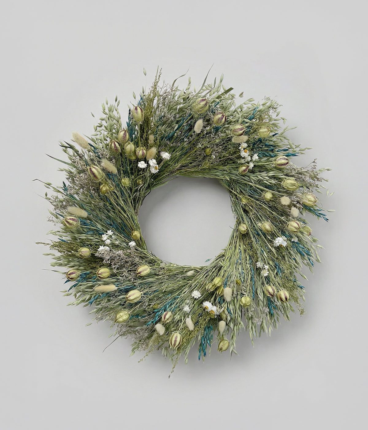 Celeste dried blue and green wreath with natural and dyed teal-blue oats, nigella, and white daisies