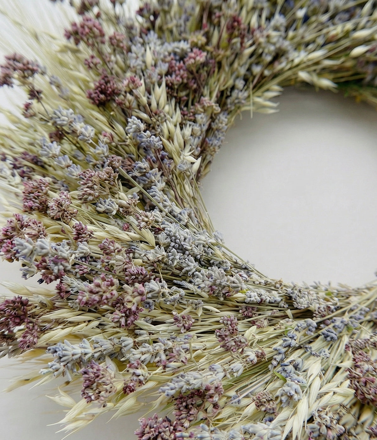Close-up of Beatrice wreath showing silvery lavender buds, oats, and kent beauty oregano