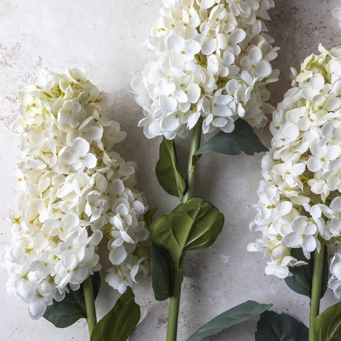 Tall faux hydrangea stem with bendable wire base for versatile home floral décor