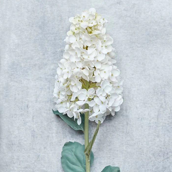Artificial cream hydrangea with small white petals and realistic leaves and stem