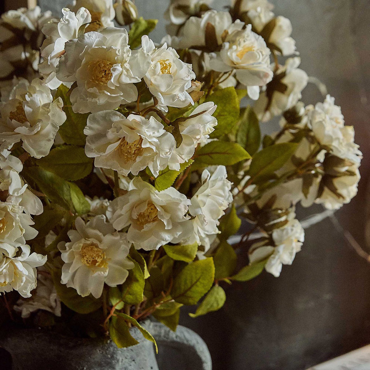 Artificial cream rose spray adds romance to wedding centerpieces or hallway vases