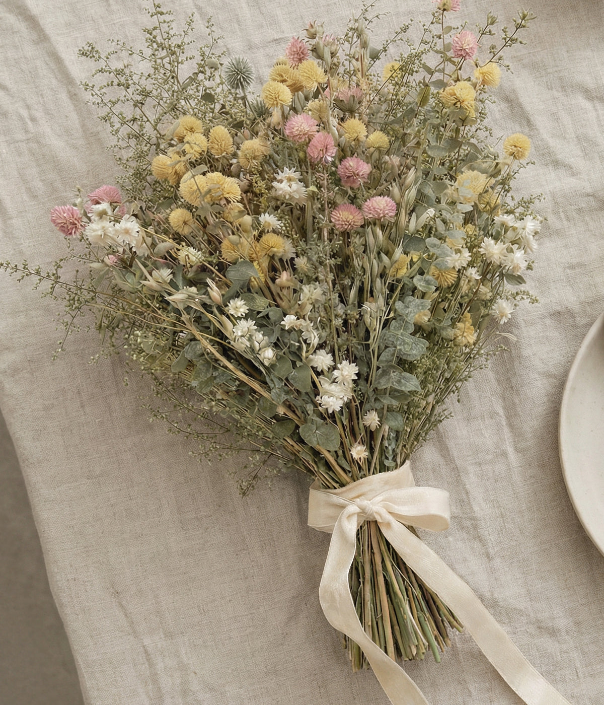 Neutral dried flower arrangements with soft blush and cream tones