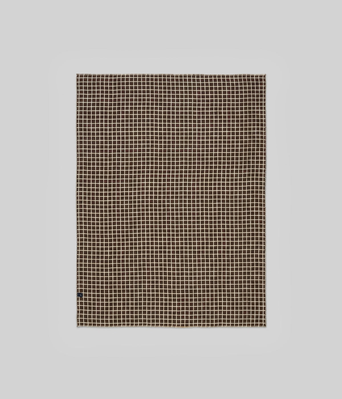 Floyd throw ivory face showing fine coffee grid lines across full field