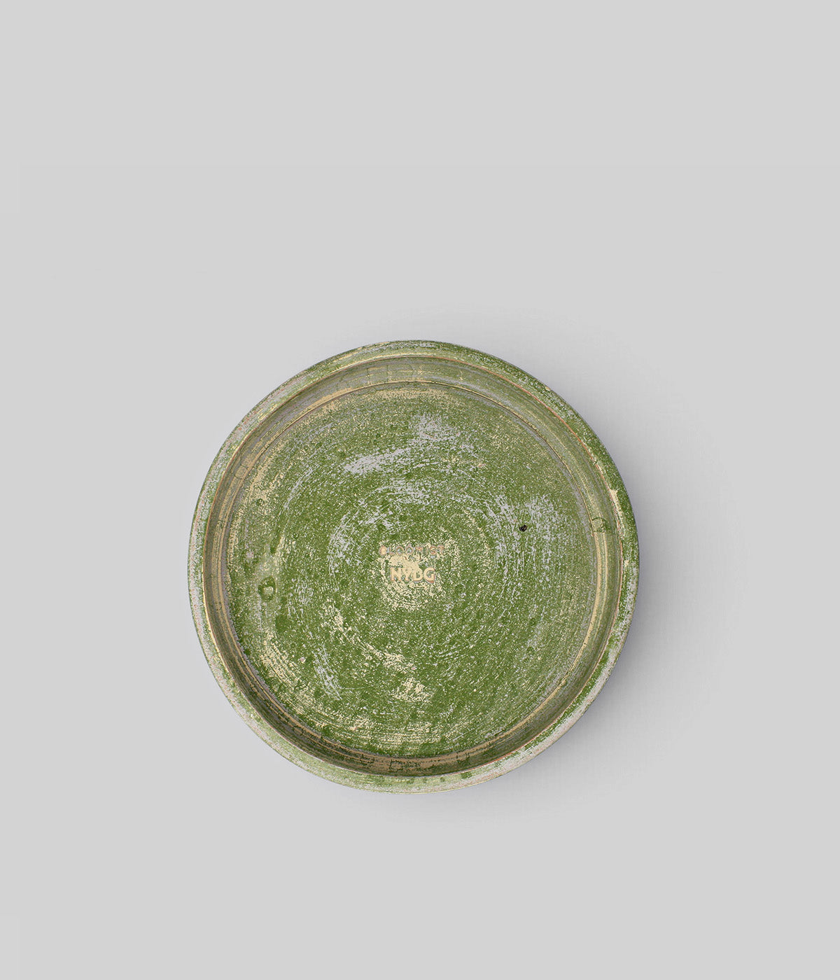 Top view of a Bloomist x NYBG Garden Sage planter tray showing its circular form, textured sage surface, and impressed center mark