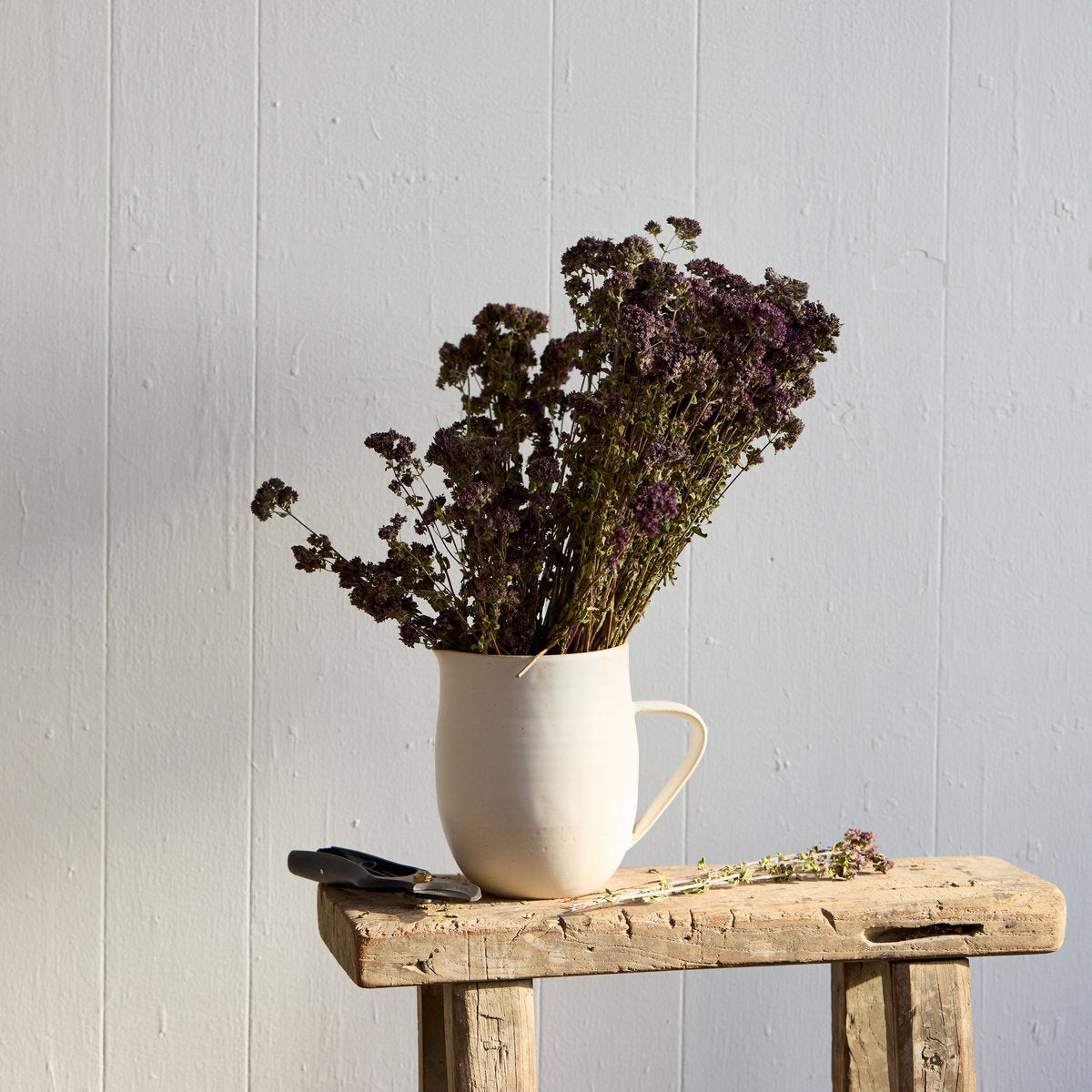 Farmhouse stoneware pitcher in white glaze for serving drinks or holding flowers