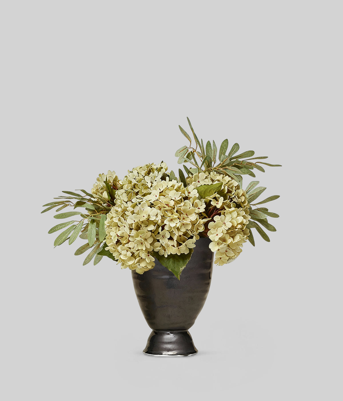 Margot artificial bouquet in a tall black vase