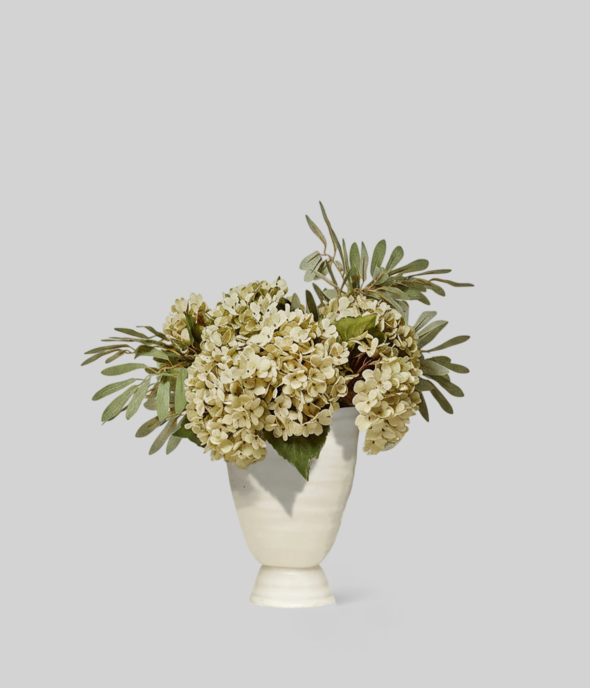 Soft green faux hydrangea arrangement ideal for dining tables or console styling