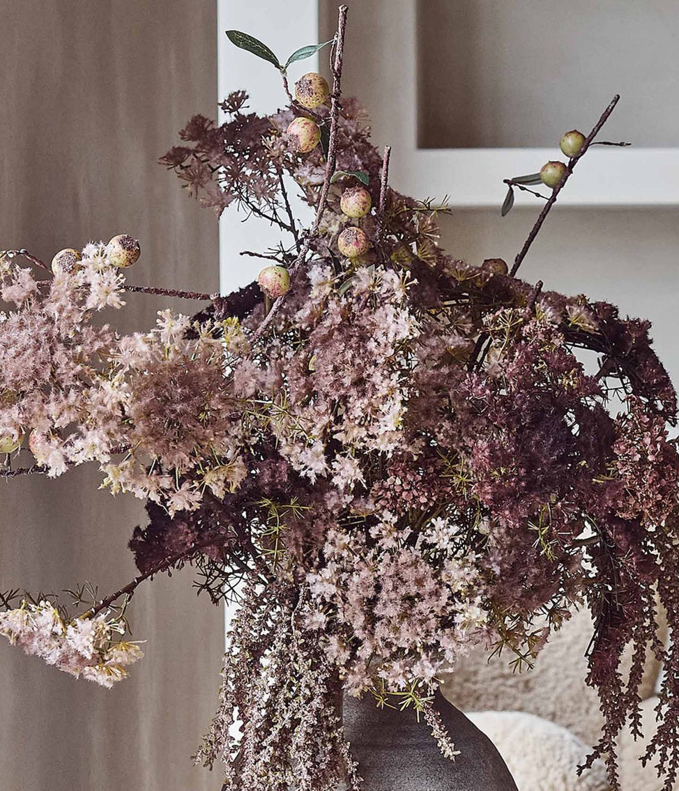 Pink and purple artificial flowers for interior styling