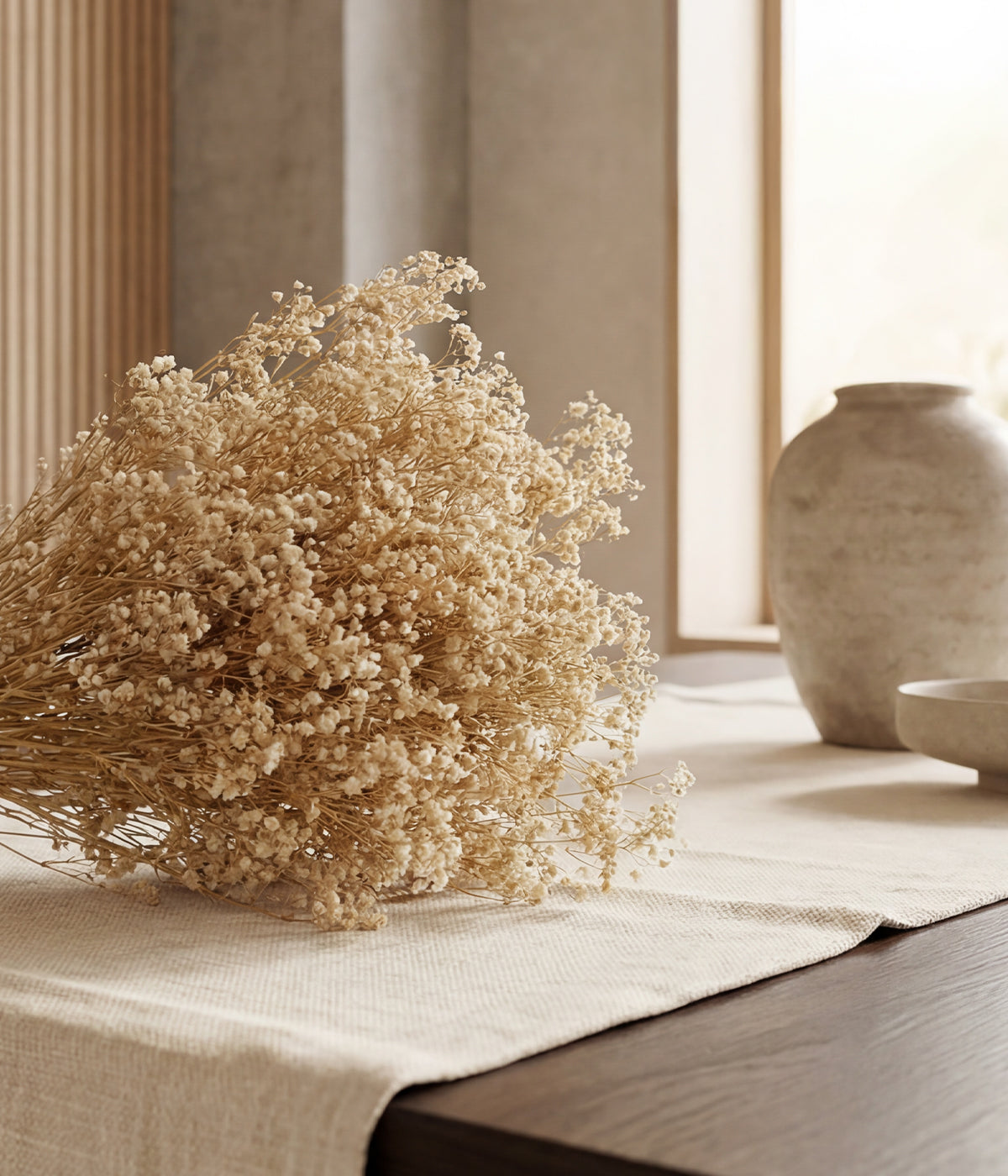 Preserved white gypsophila flowers with airy blonde clusters tied together