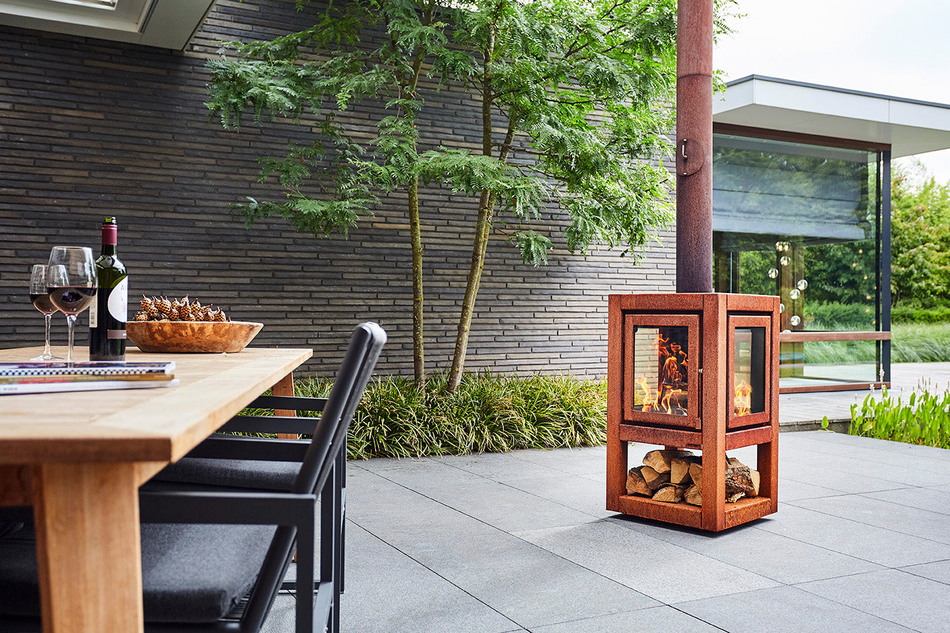 modular outdoor fireplace with glass panels