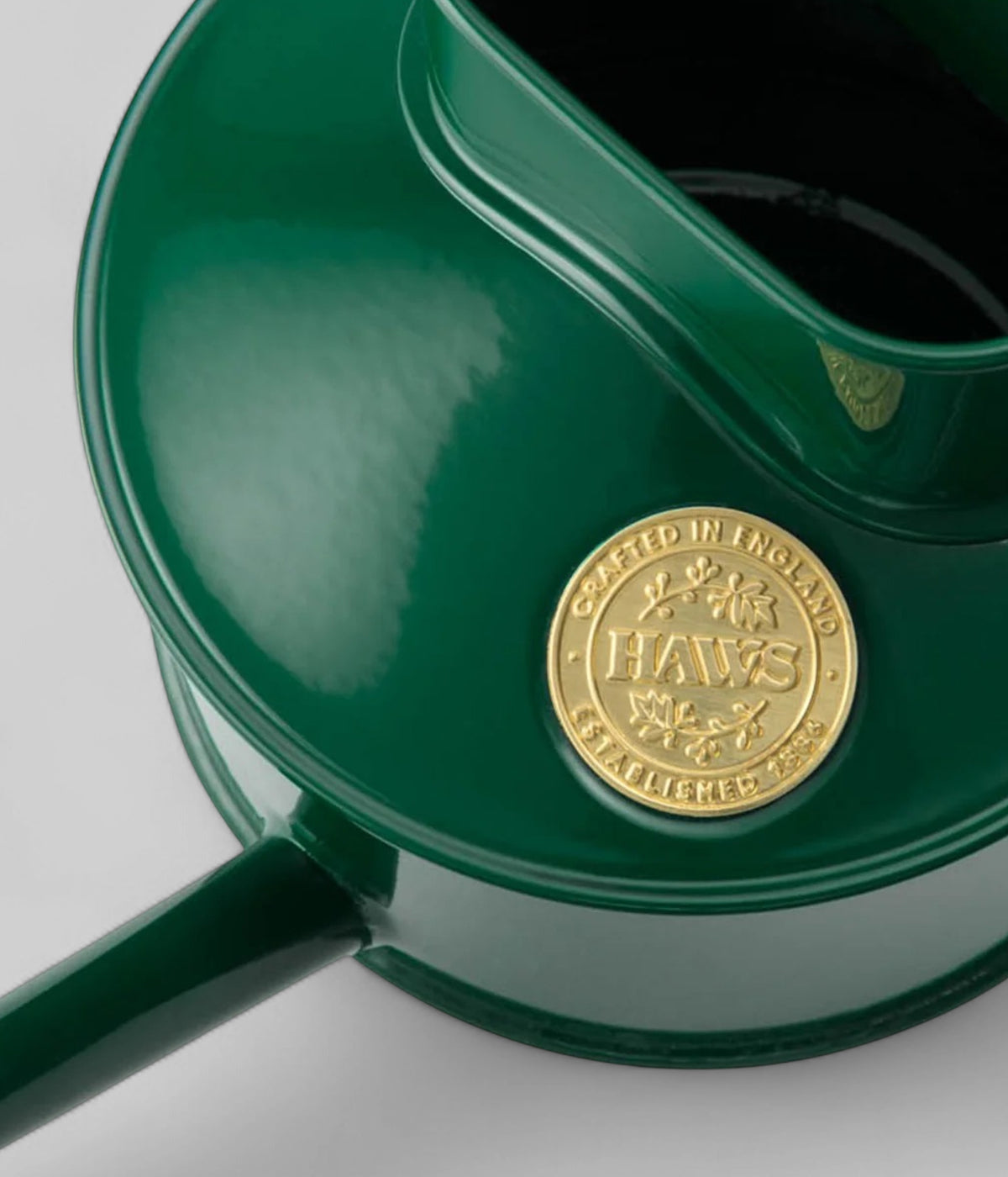 British made metal watering can with ergonomic handle and precision pour spout