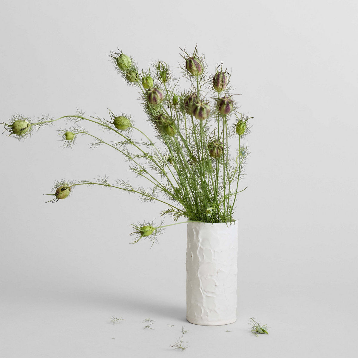 White vase with waterproof interior for fresh flower arrangements