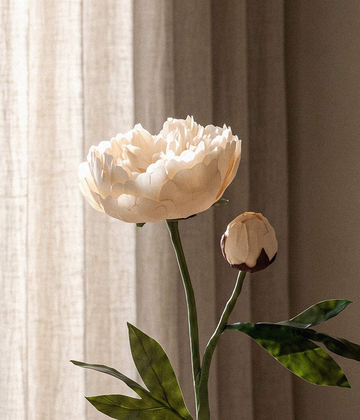 Handmade paper peony with warm ivory petals and bud displayed against linen curtains