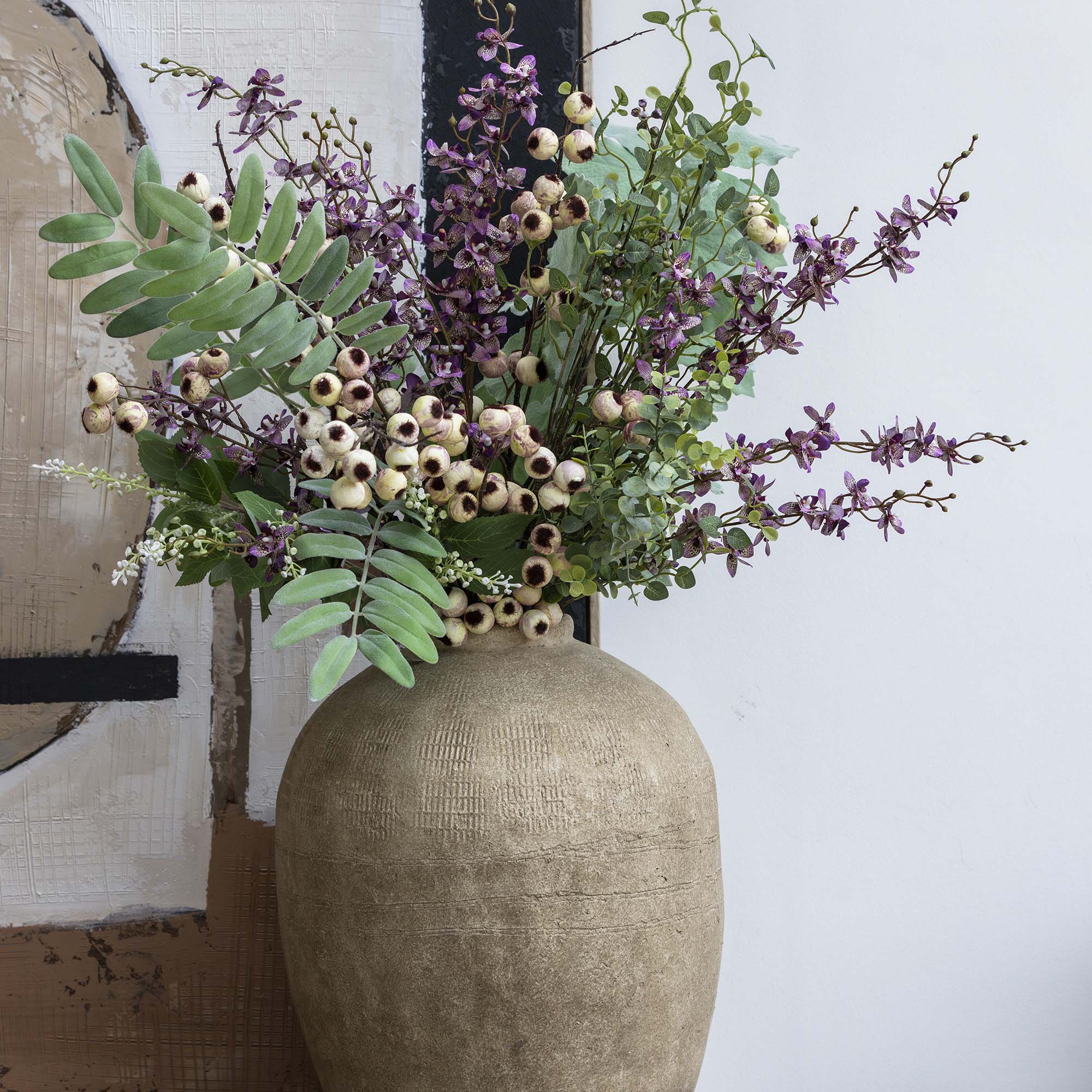 Purple faux orchid arrangement with natural variation and movemen