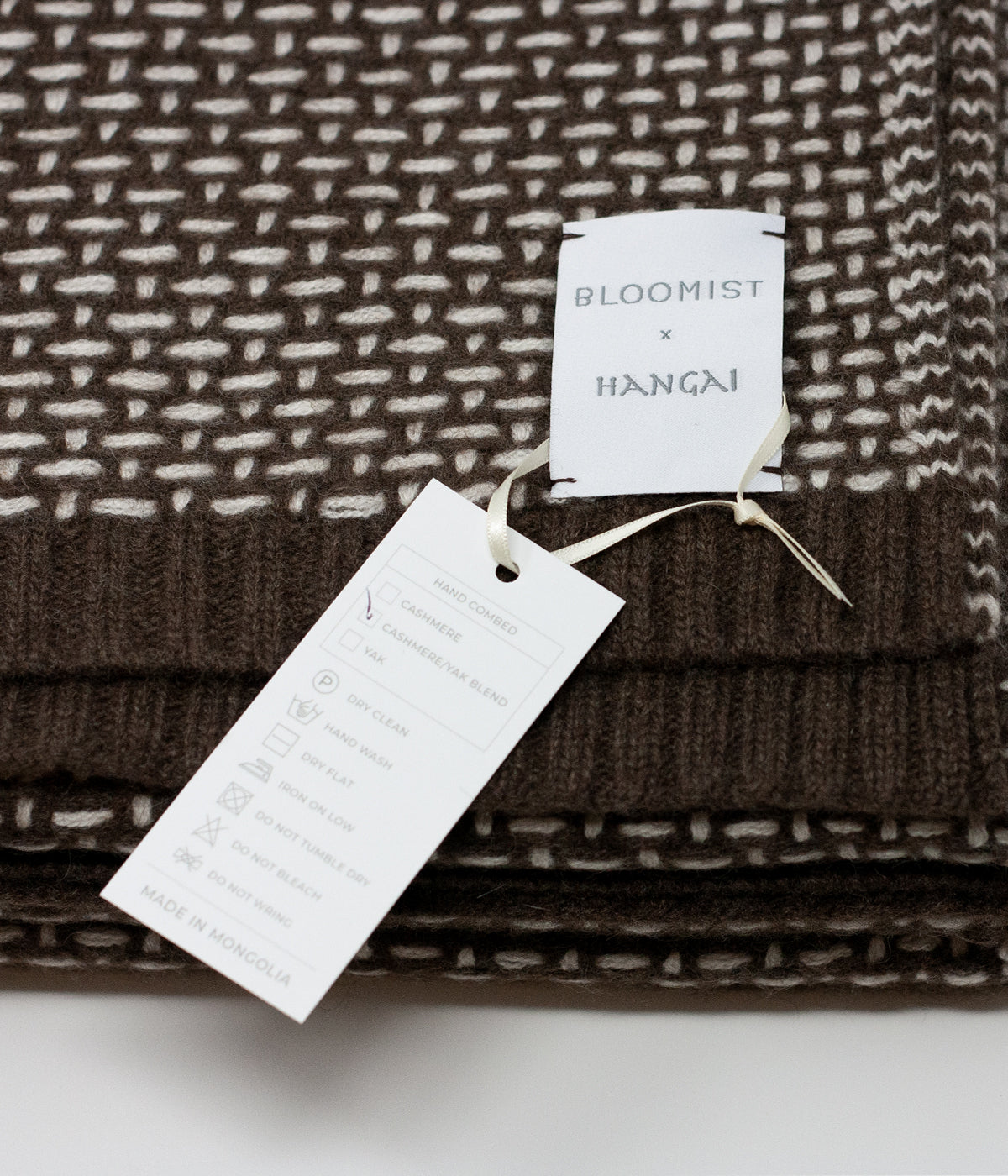 brown and white throw blanket handcrafted in Mongolia