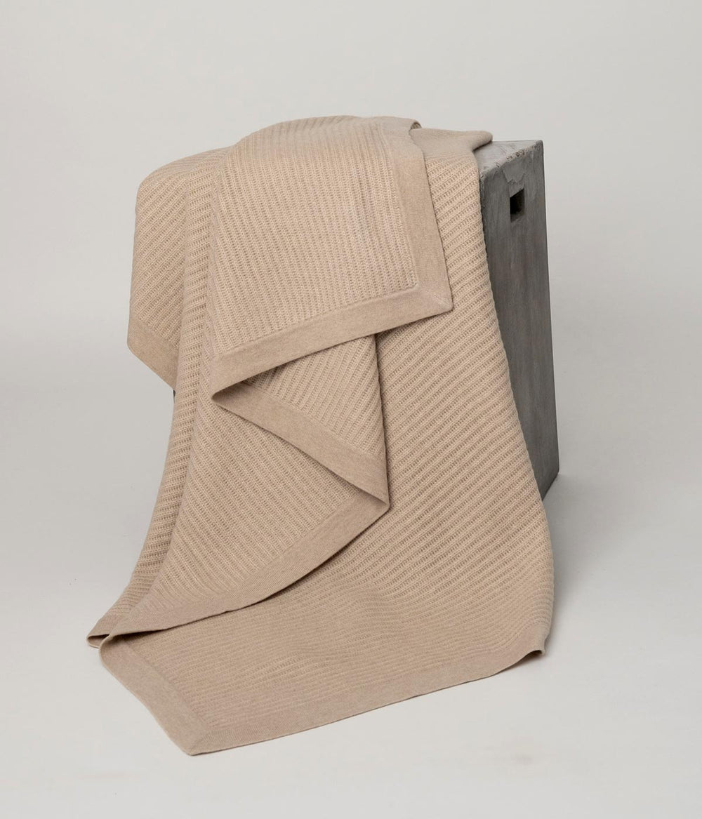 Handwoven Beige Cashmere Knit Throw, offering breathable warmth and artisanal craftsmanship
