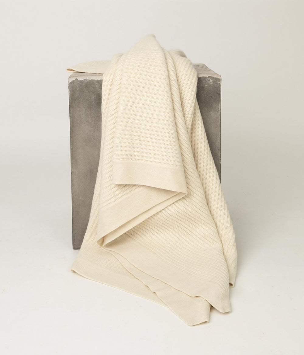 Cream Cashmere Throw with fisherman’s knit, a perfect blend of texture and softness