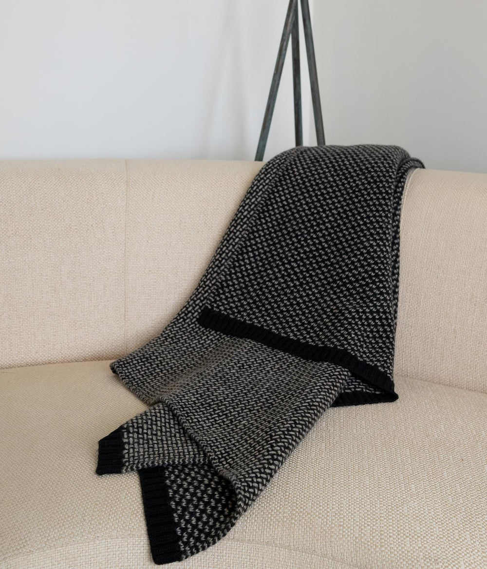 Yak down blanket on a chair, blending natural warmth and contemporary style