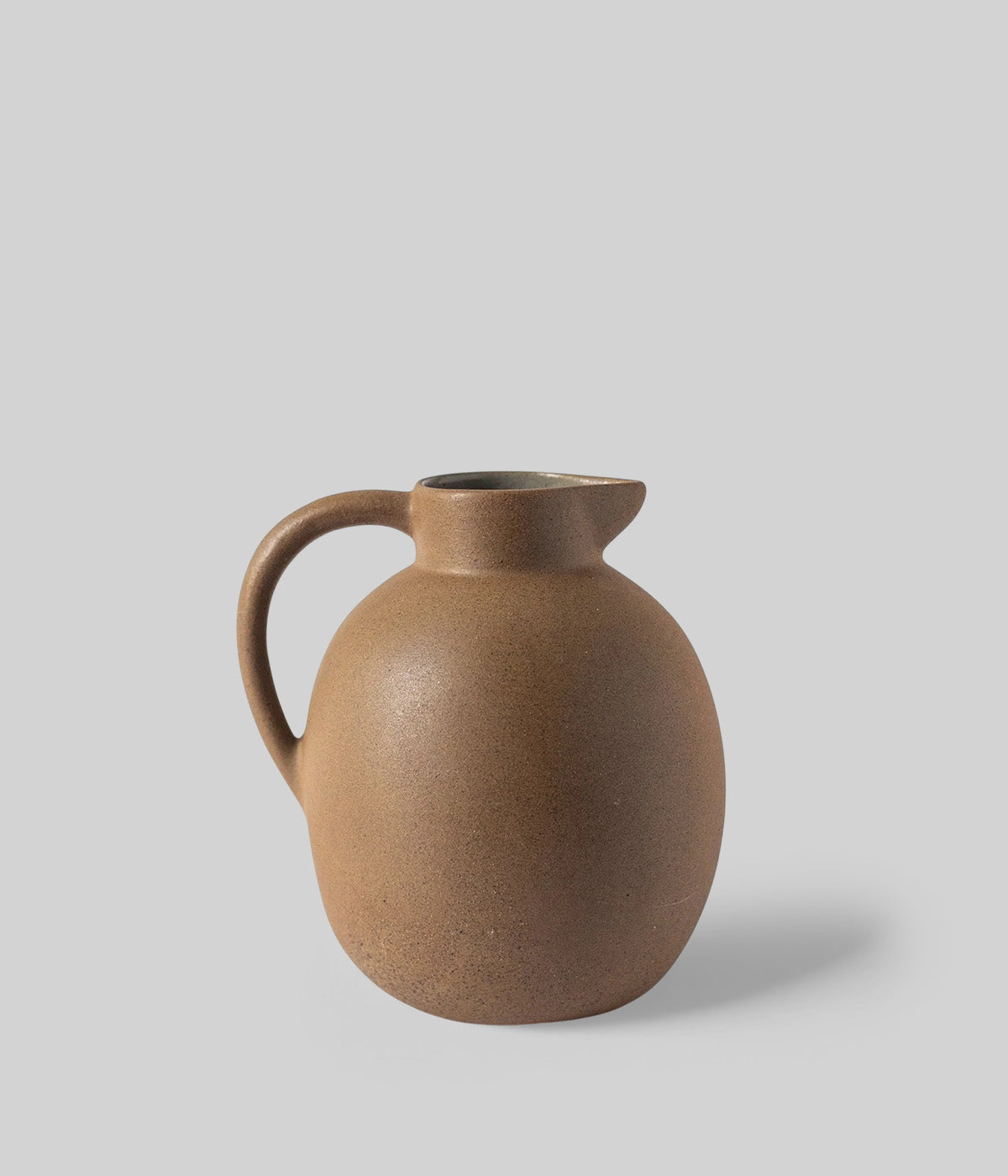 ceramic round vase with arched handle made from natural Mexican clay