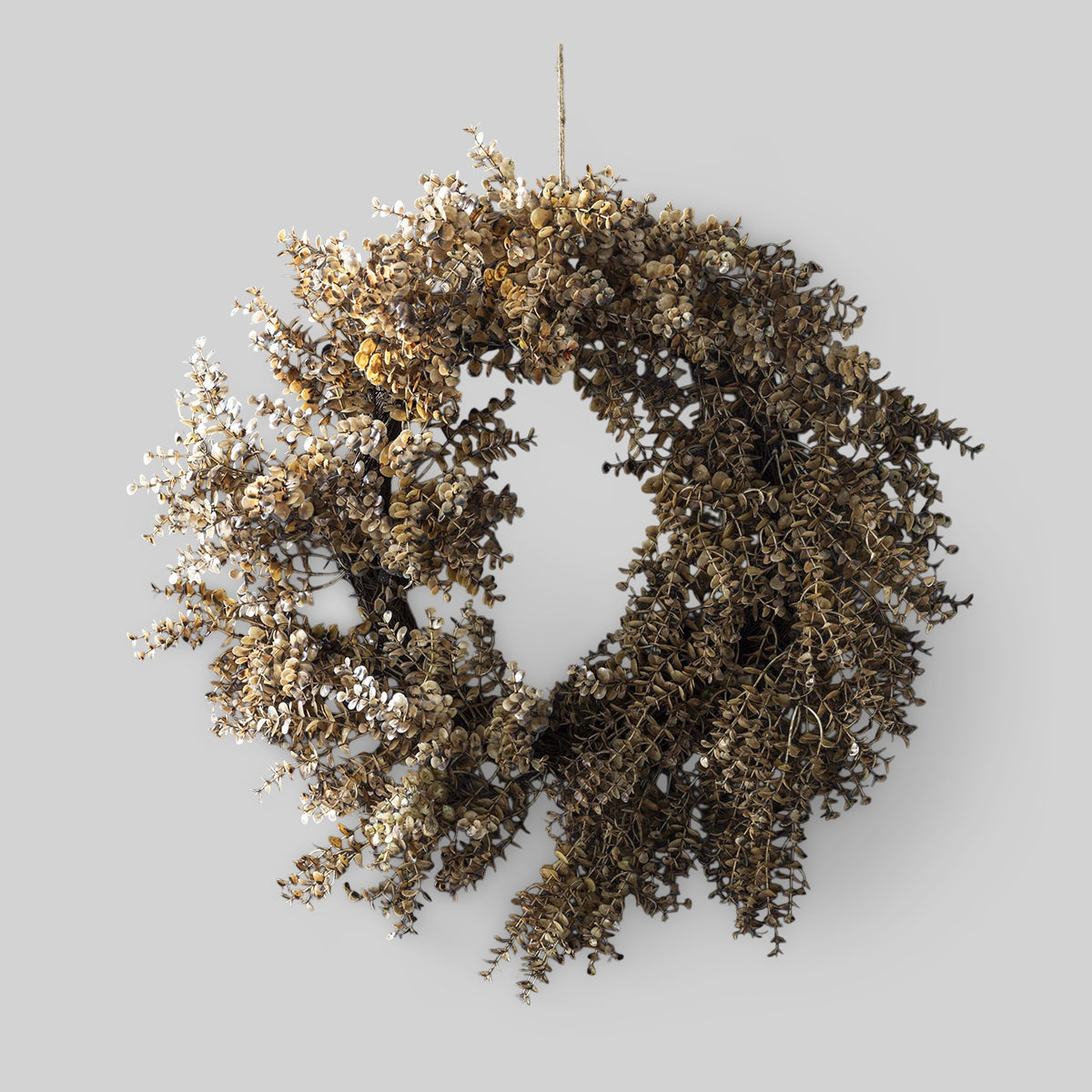 Artificial botanical wreath with soft green eucalyptus leaves for wall décor