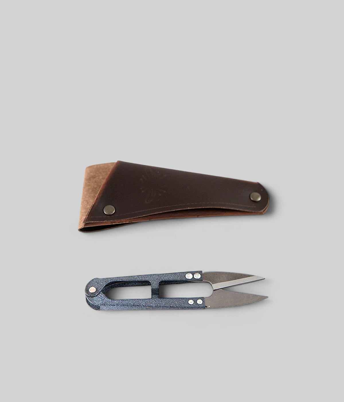 Compact garden snips with soft leather pouch for trimming herbs and small stems
