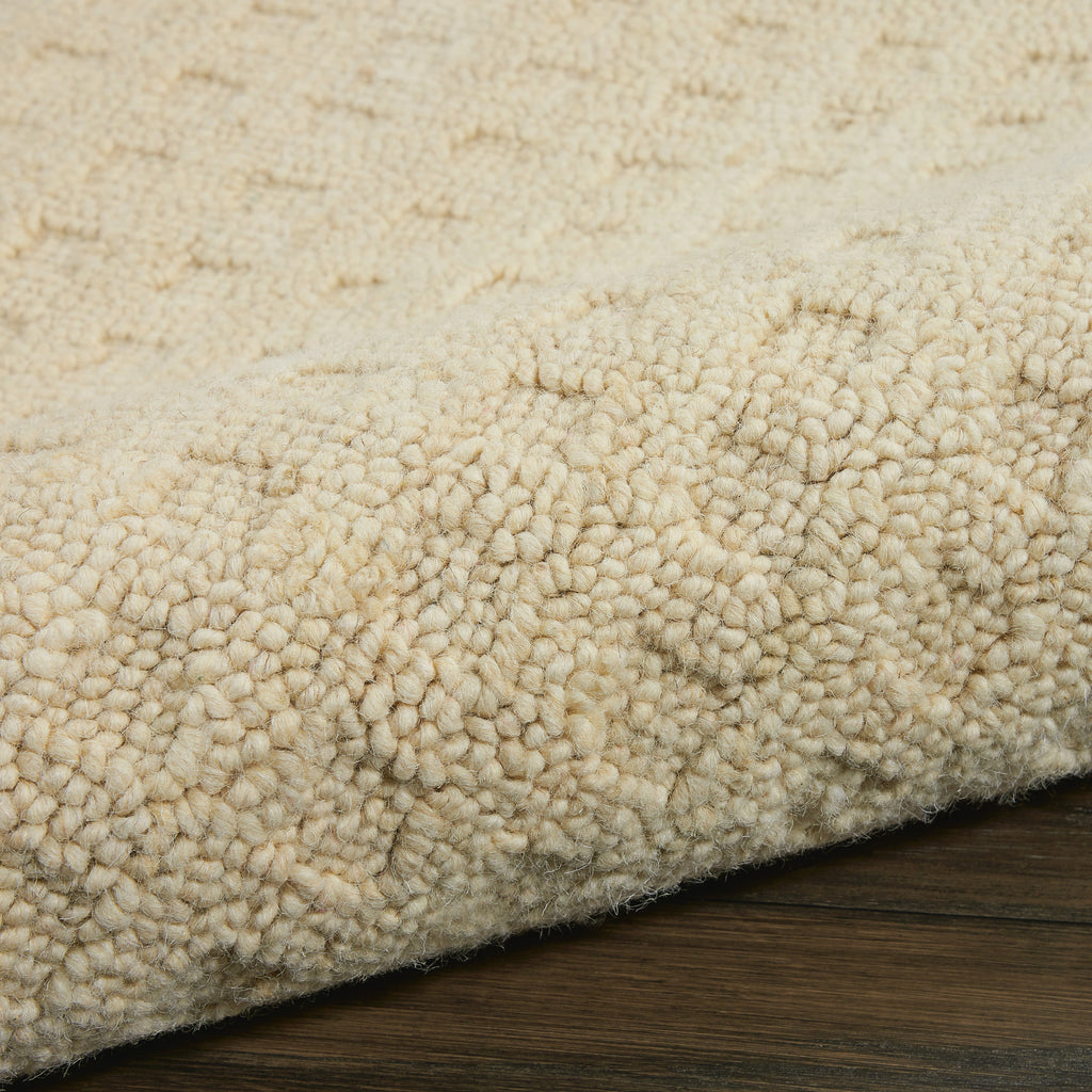 Perris Solid Ivory Area Rug