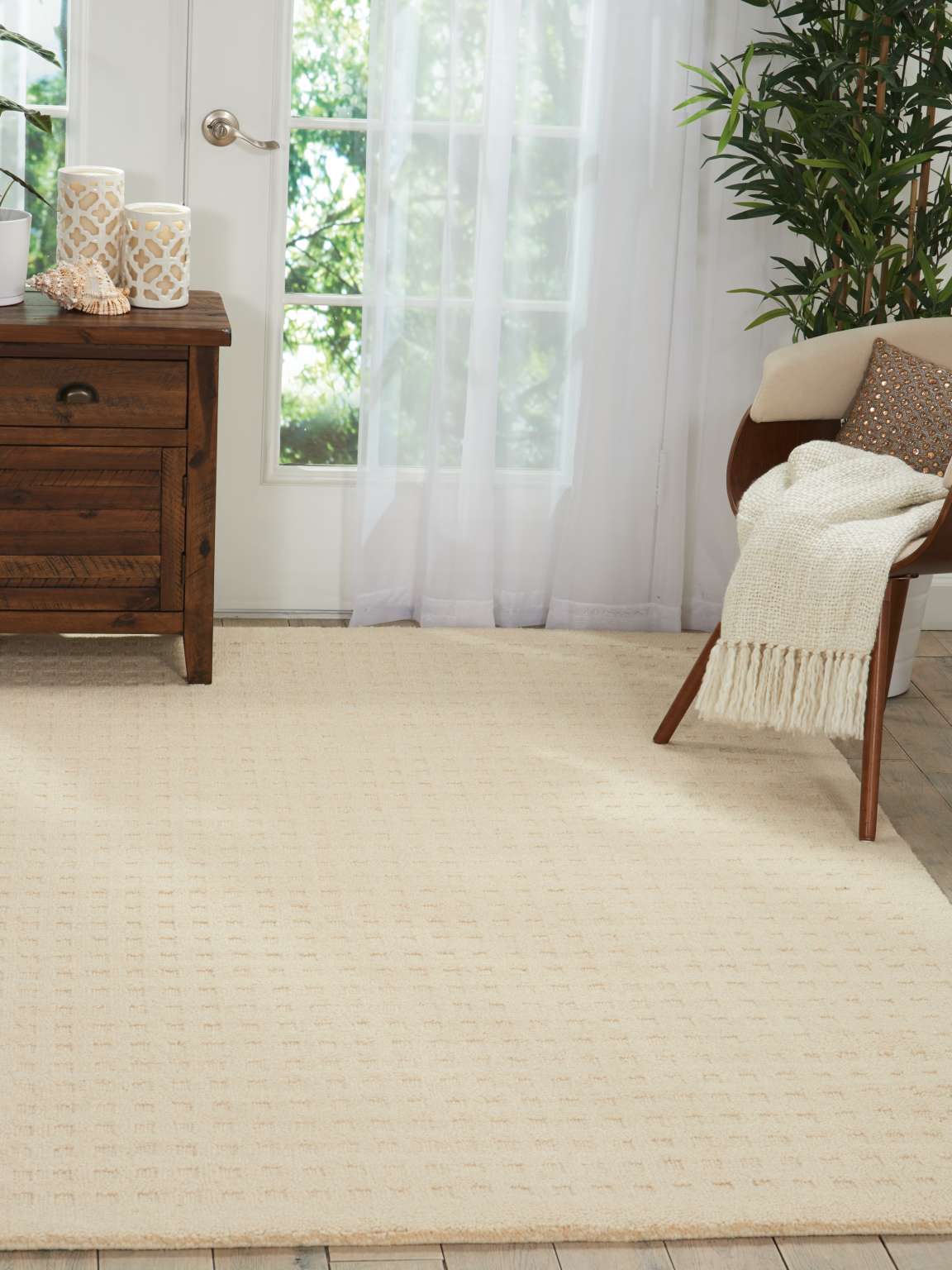 Perris Solid Ivory Area Rug