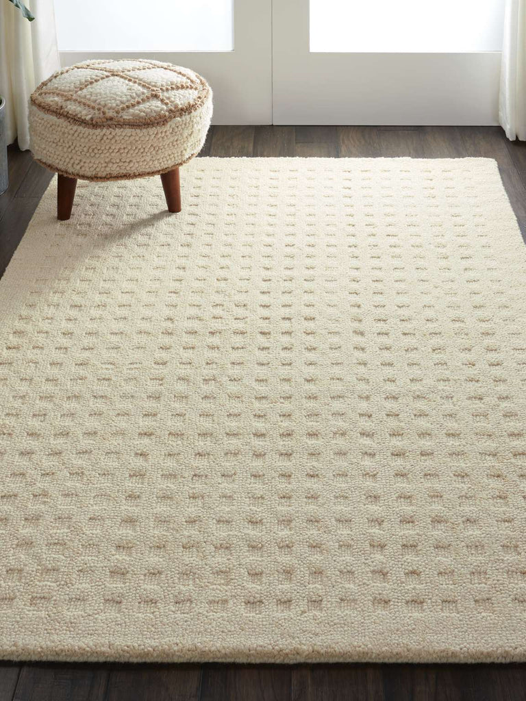 Perris Solid Ivory Area Rug