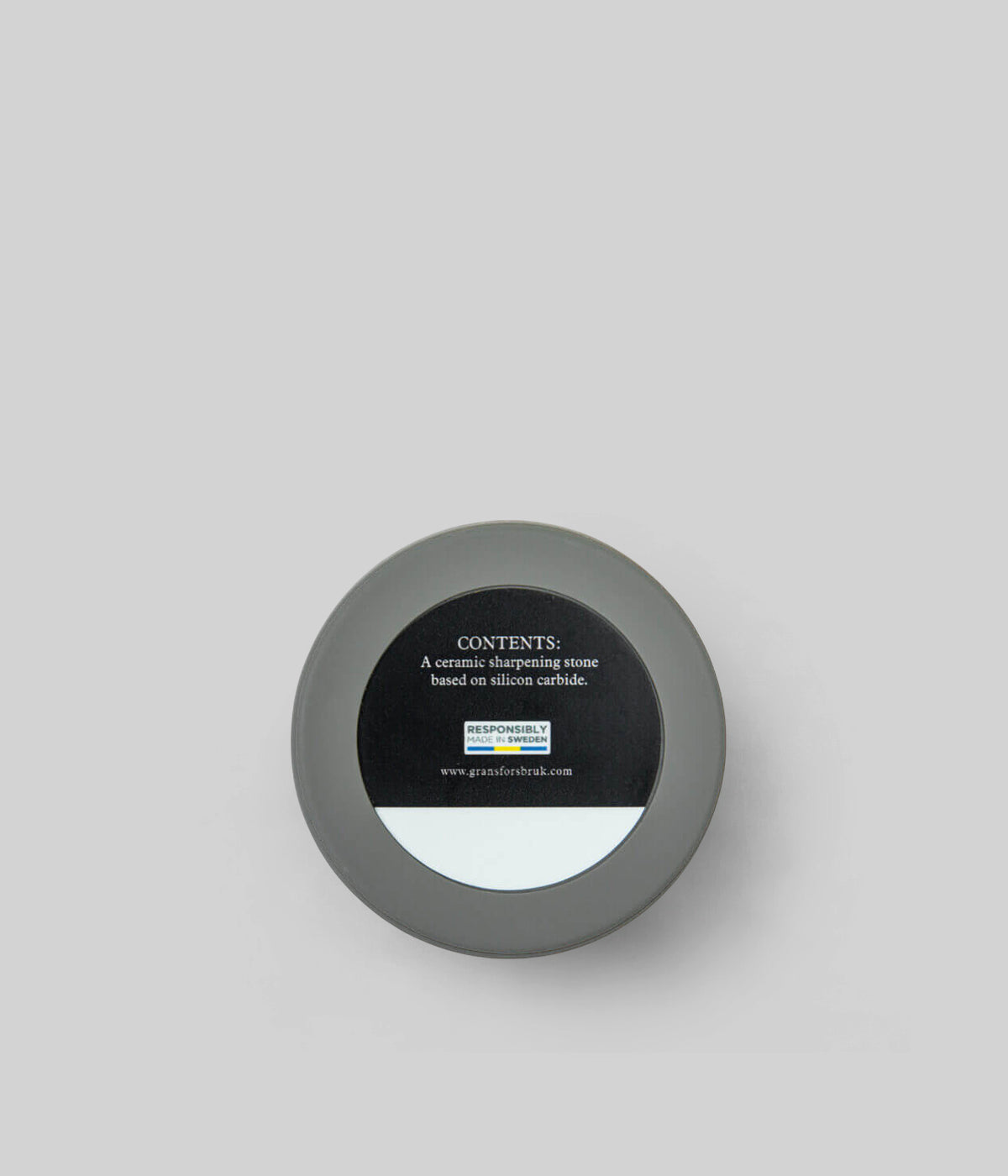 Durable ceramic sharpening tool with rubber case for field and workshop use