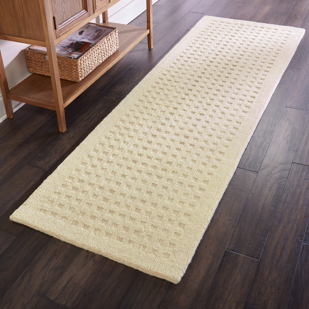 Perris Solid Ivory Area Rug